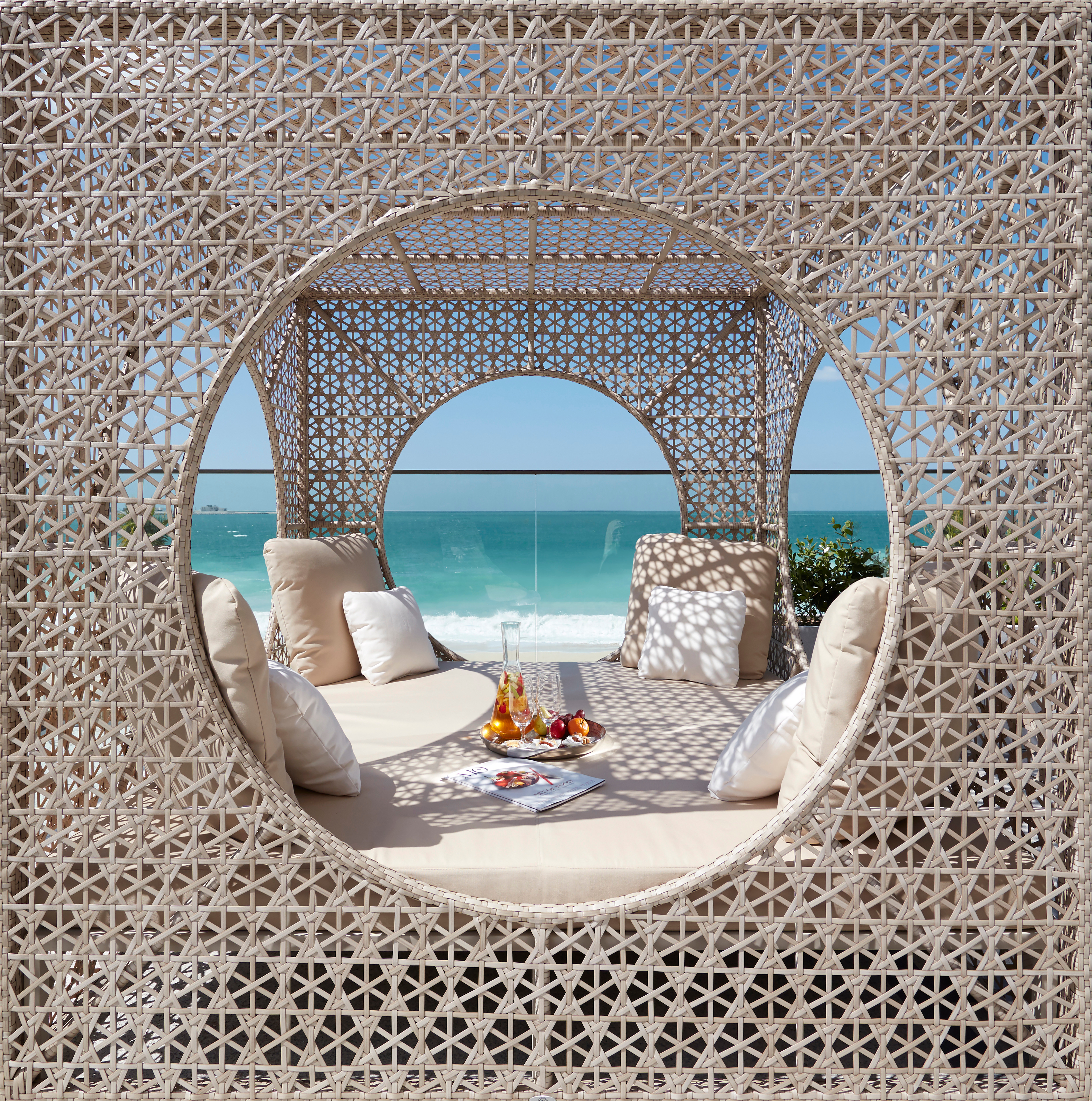 Luxury daybed with a view of the water.